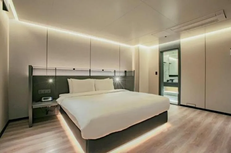 Bed in L&L City Hotel