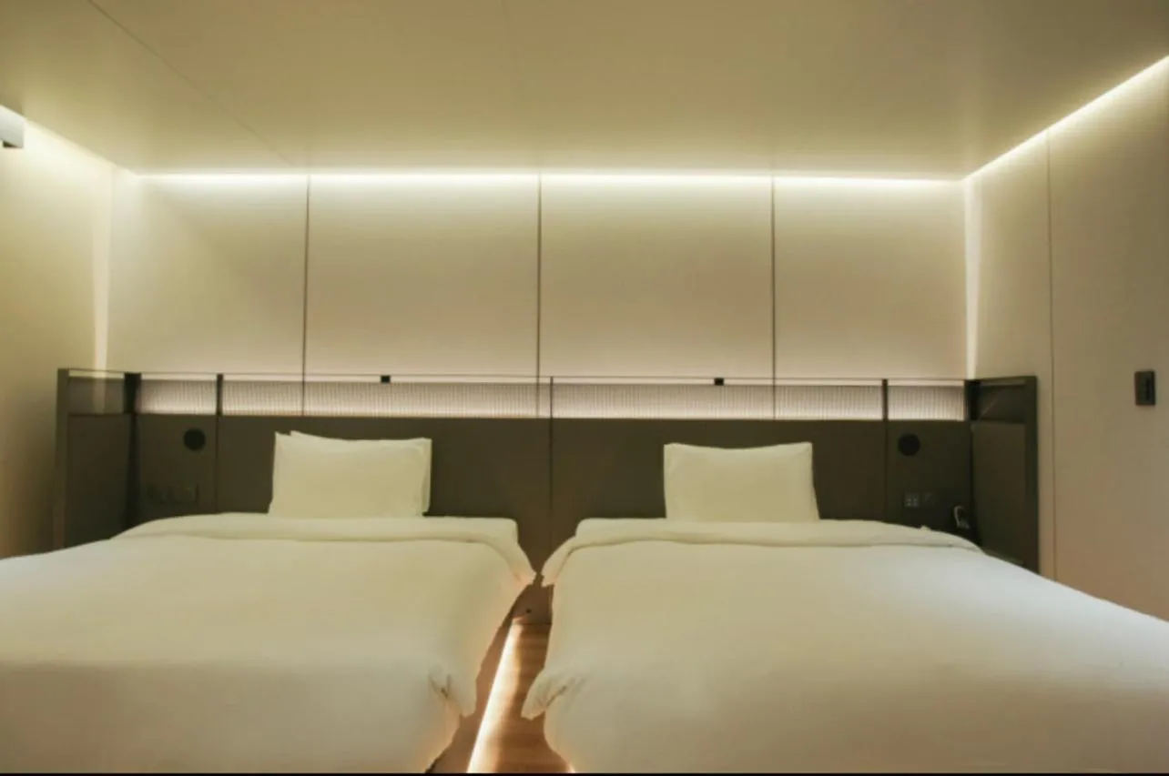 Bed in L&L City Hotel