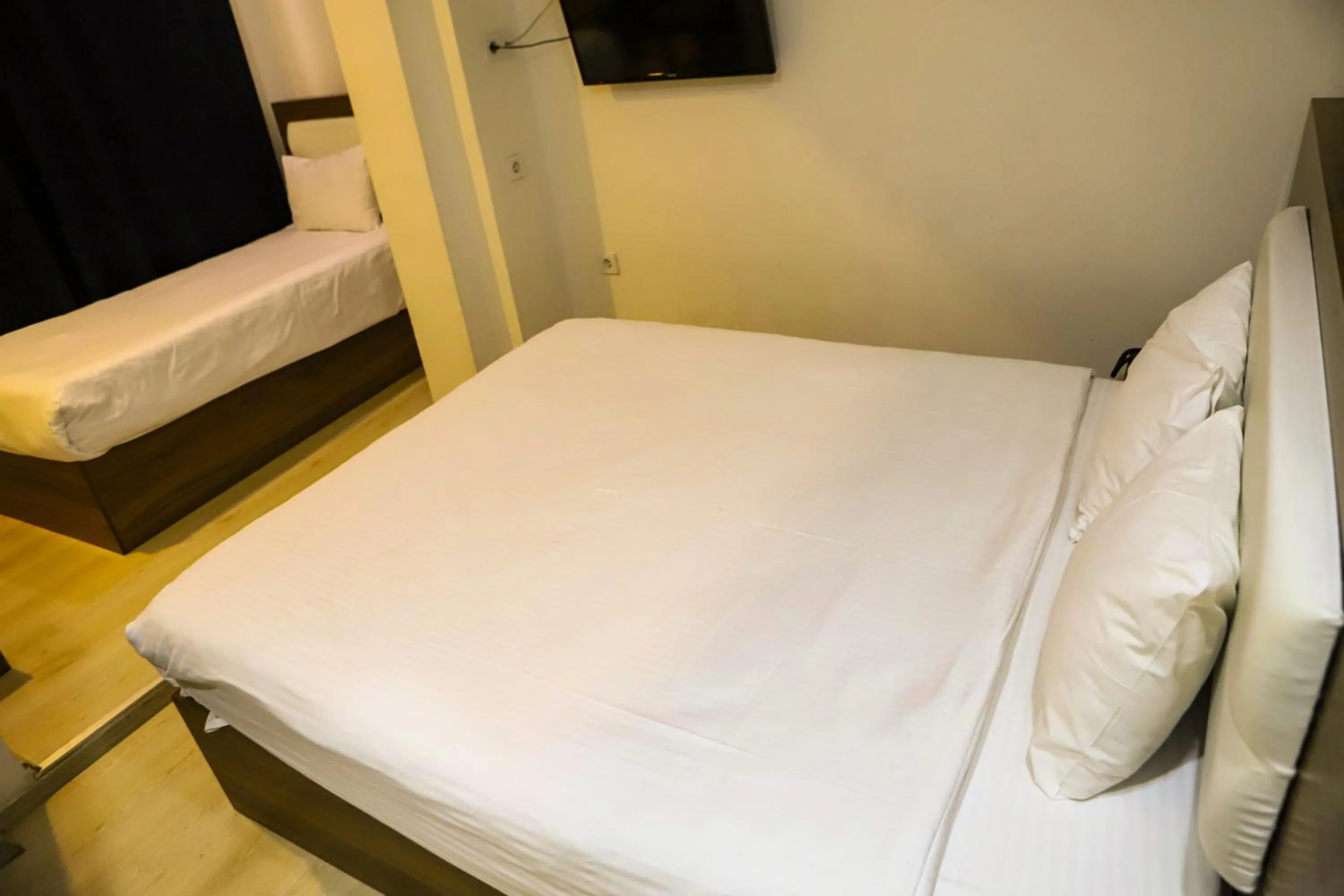 Bed in MITANI SUITES