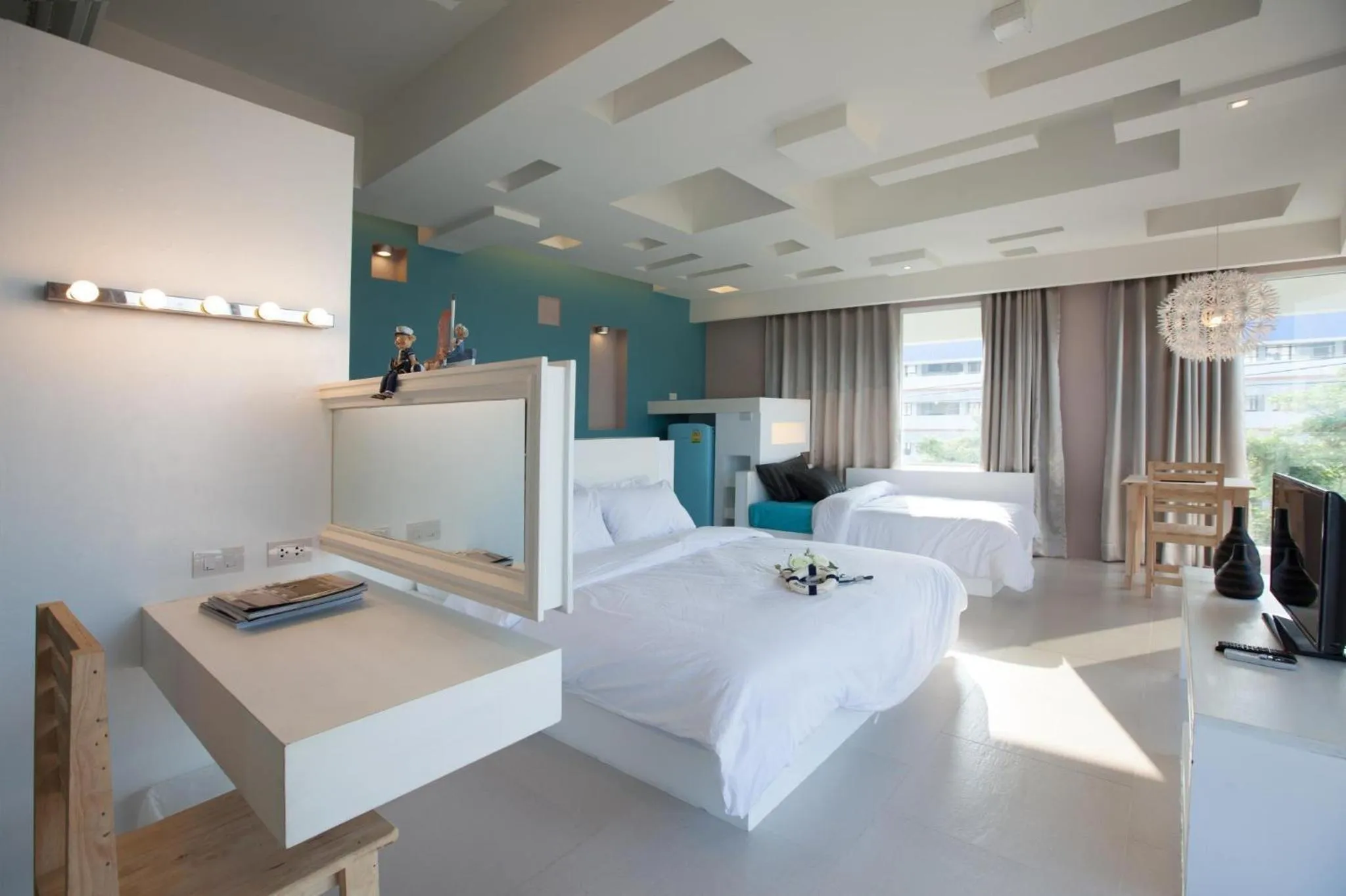 Bed in O-Bay Design Hotel Prachuap