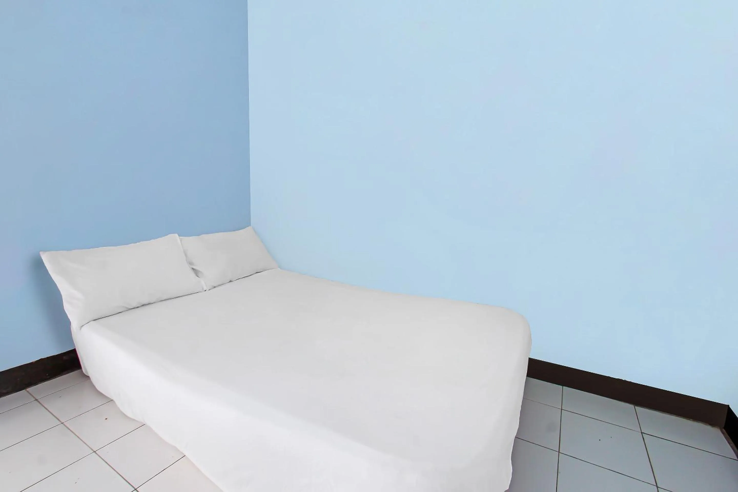 Bedroom in Hotel O Sukandi Homestay Near The Semeton Homestay