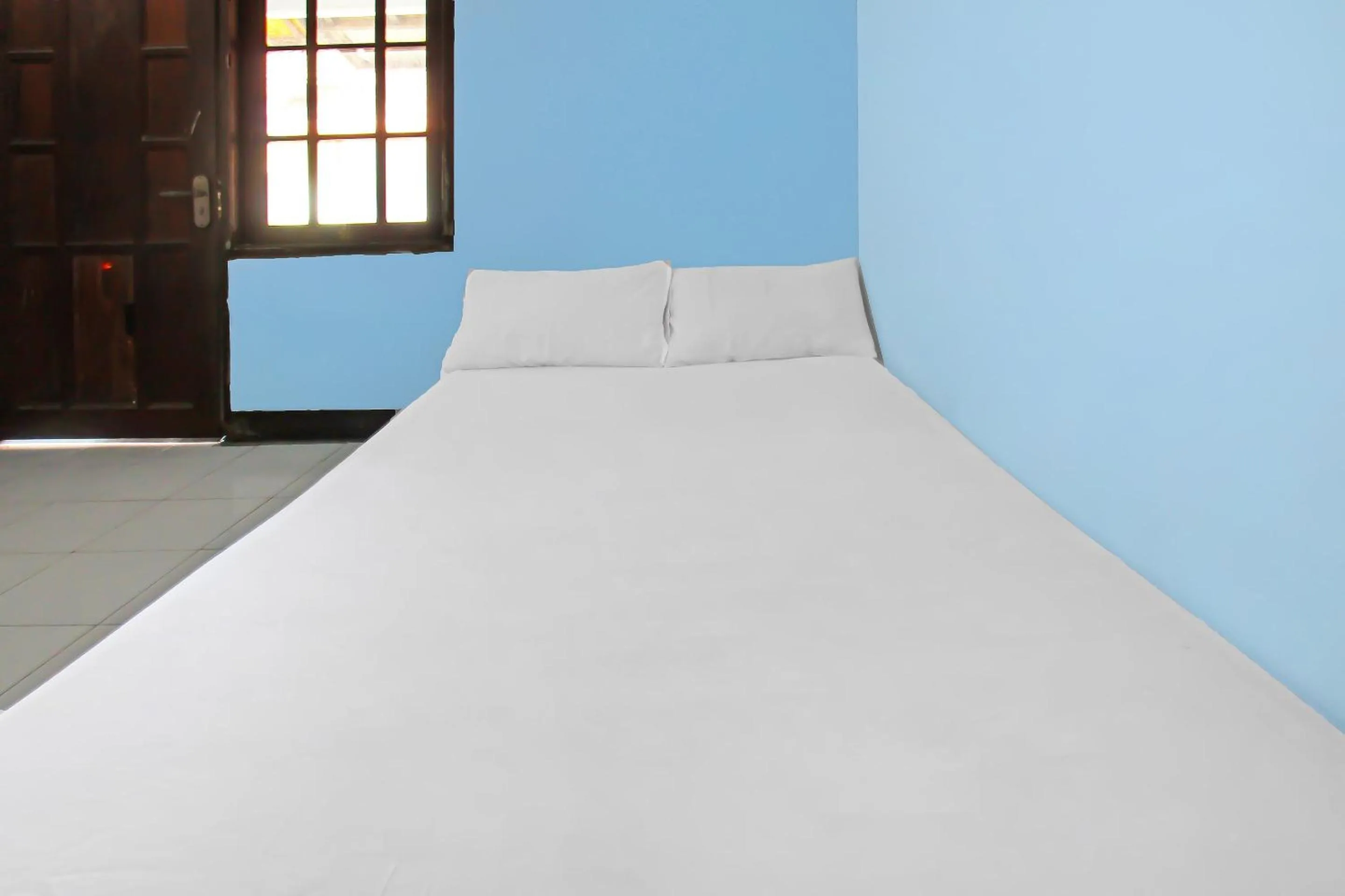 Bedroom in Hotel O Sukandi Homestay Near The Semeton Homestay