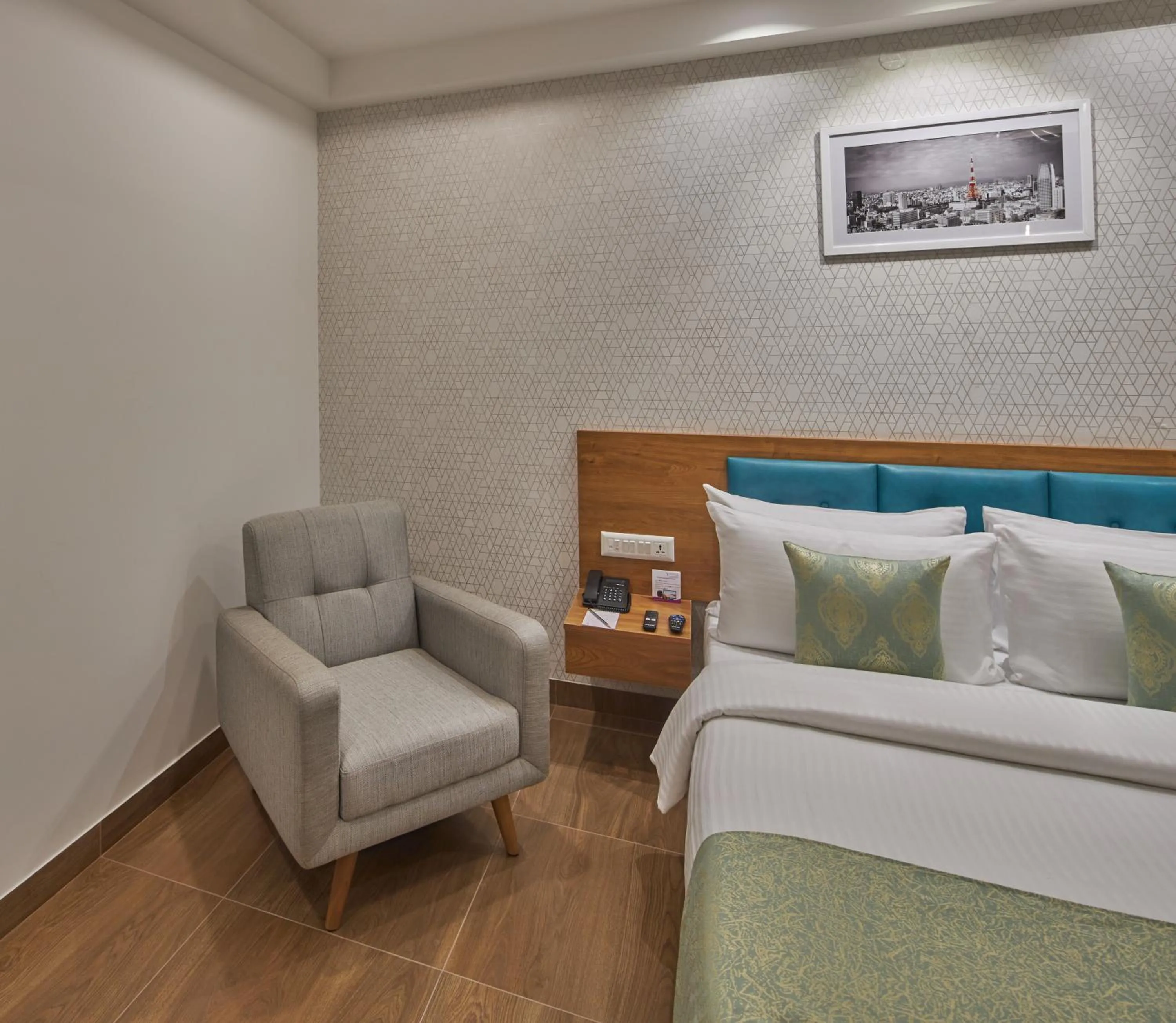 Bedroom, Bed in Regenta Inn 4th Block Koramangala Bangalore