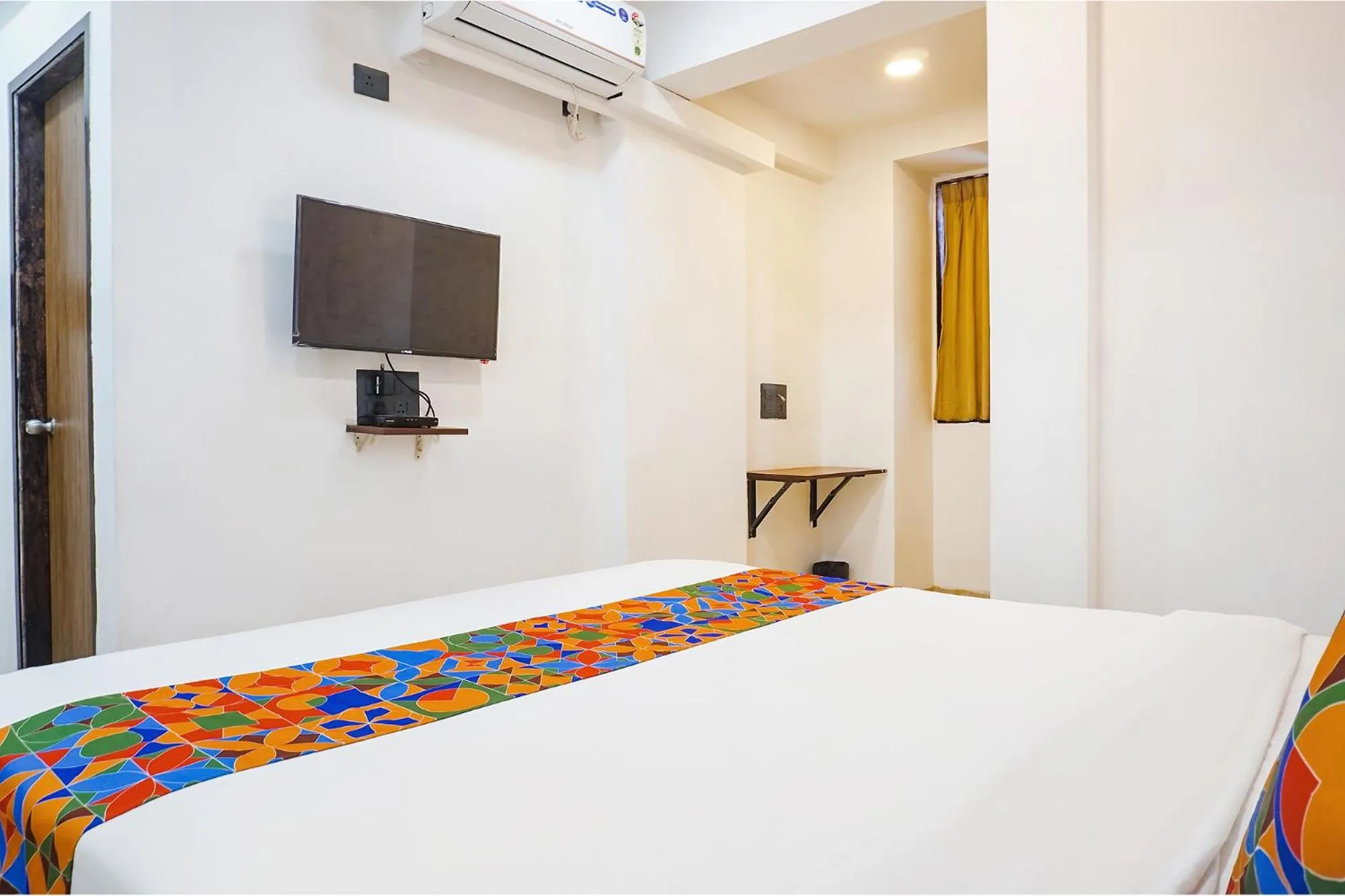 Bed in FabHotel Atithi Regency