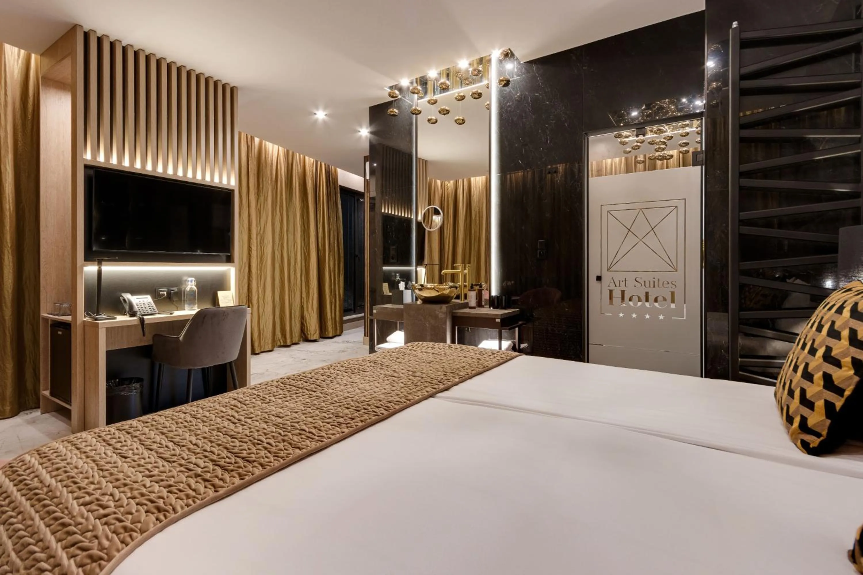 Bed in Art Suites Luxury Hotel