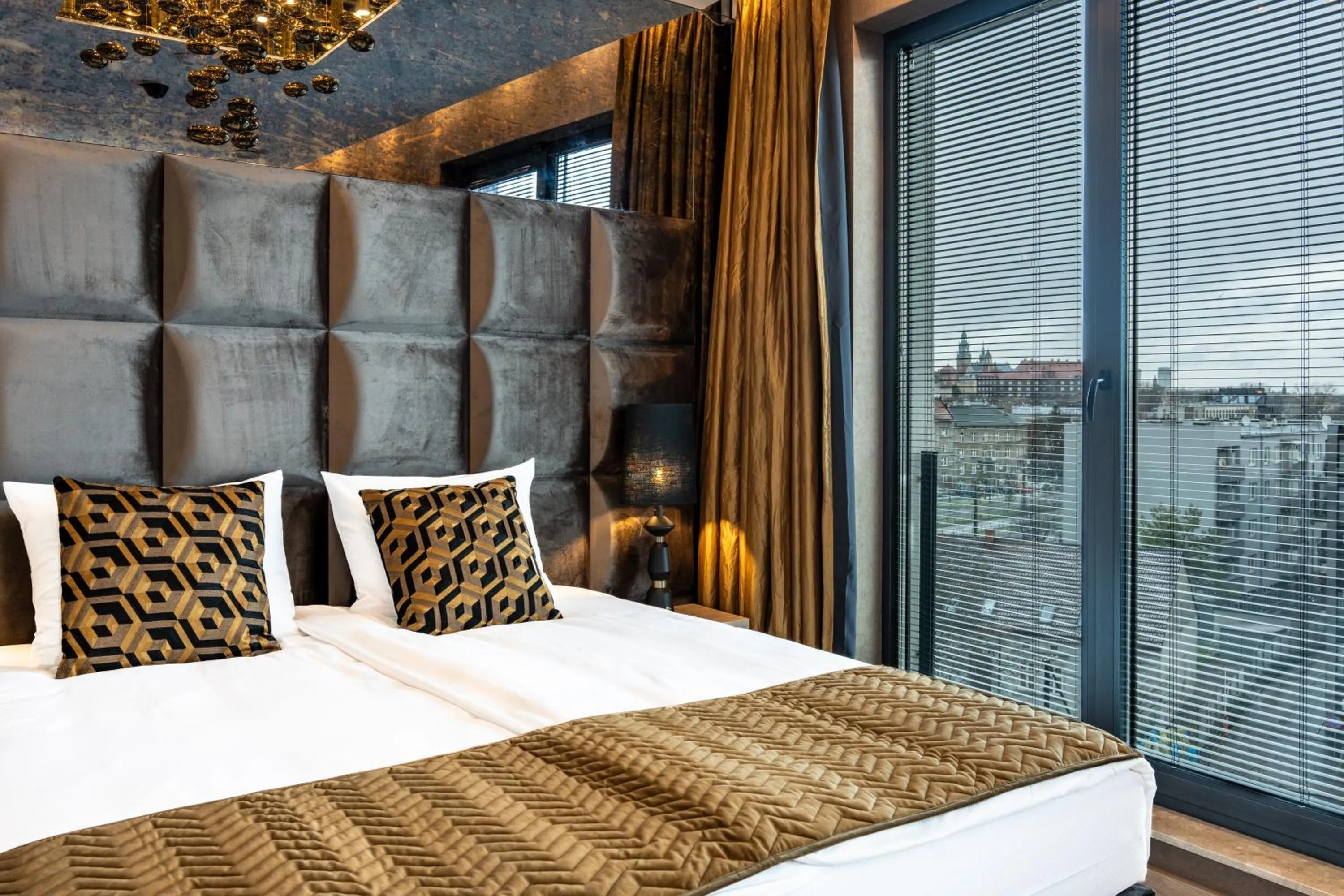 Bed in Art Suites Luxury Hotel