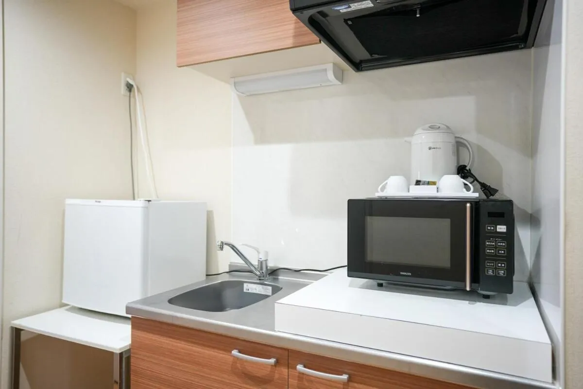 Kitchen or kitchenette in Hotel J&C-I