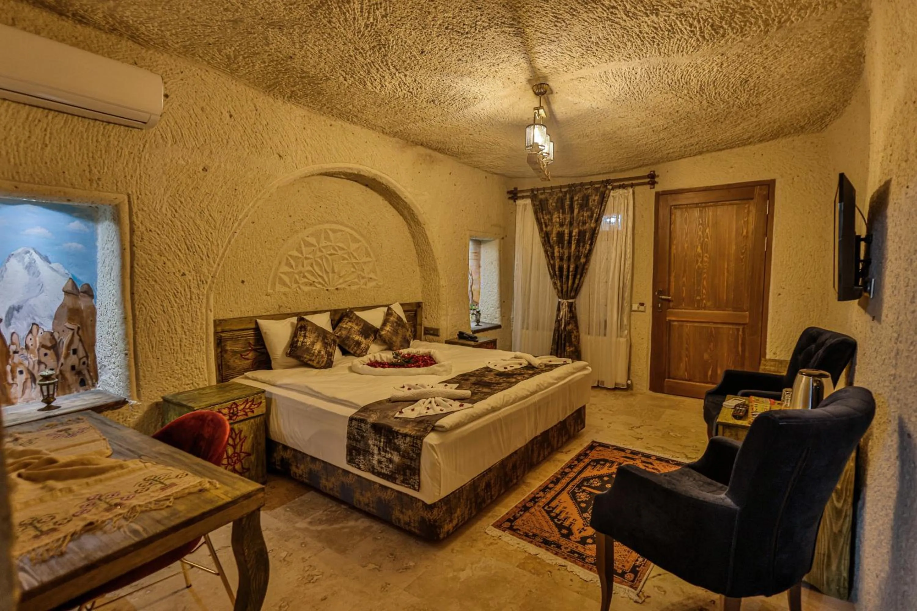 Photo of the whole room, Bed in CaveAdocia Stone&Cave Hotel
