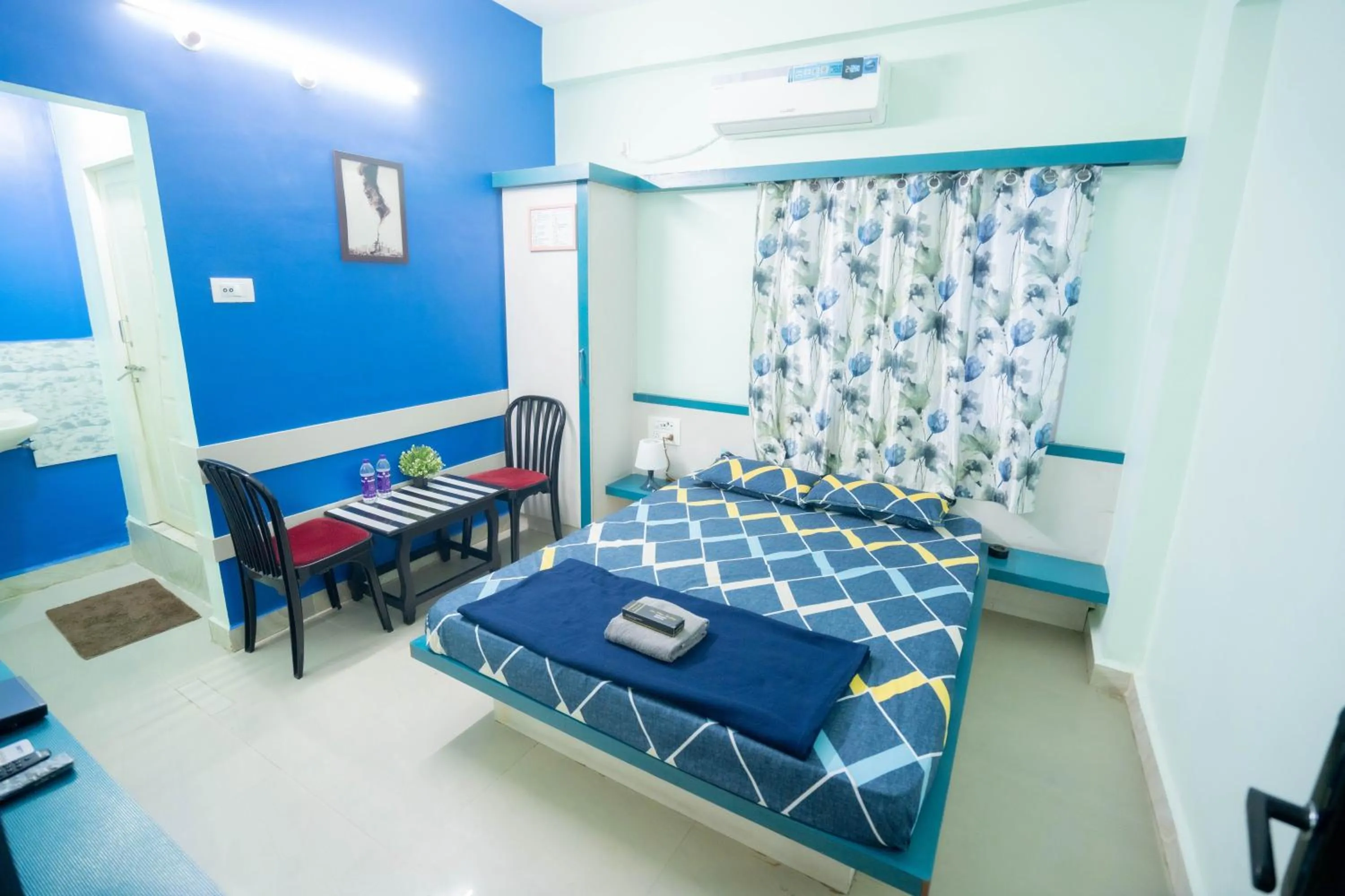 Photo of the whole room, Bed in Sree Theja Residency