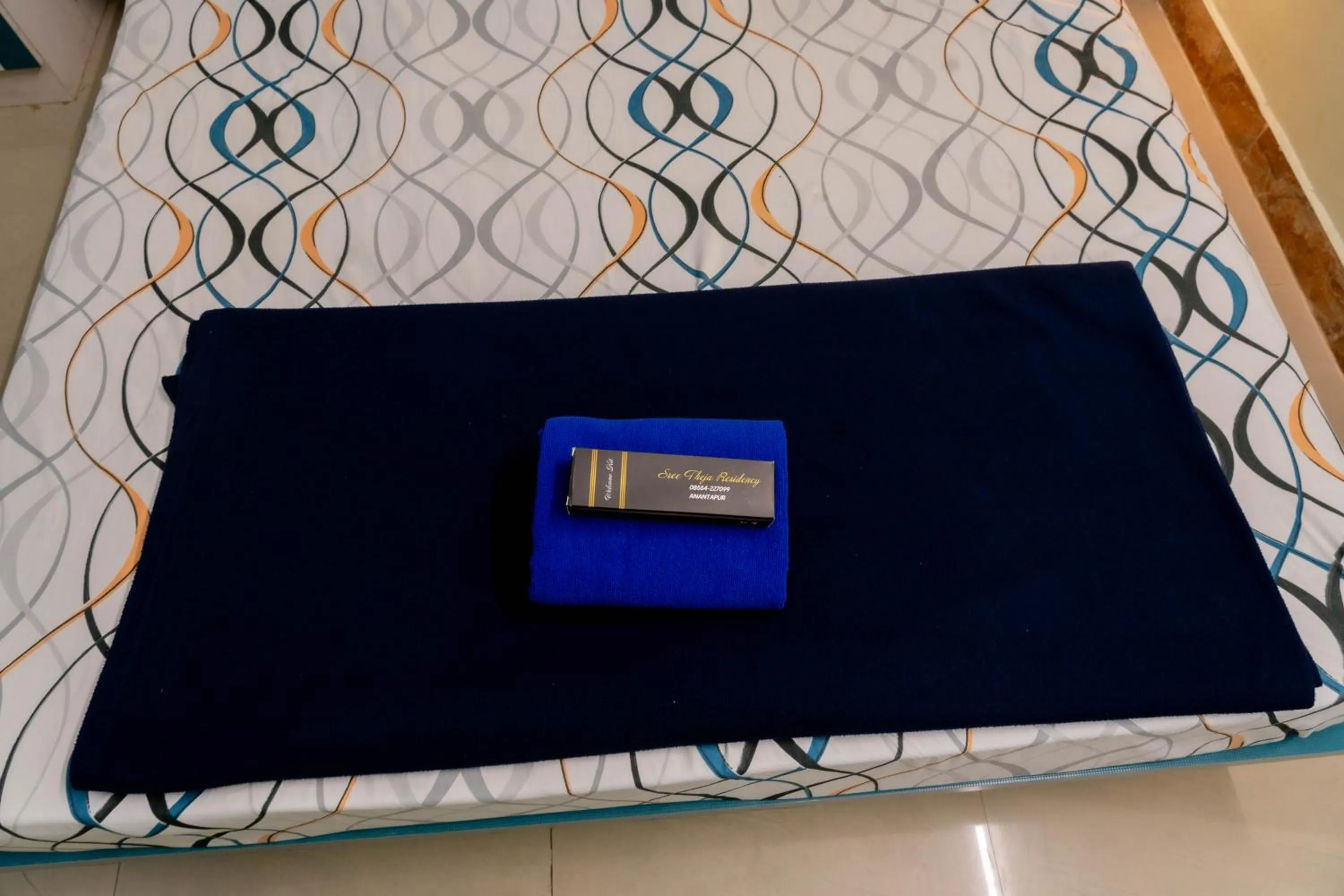 Bed in Sree Theja Residency