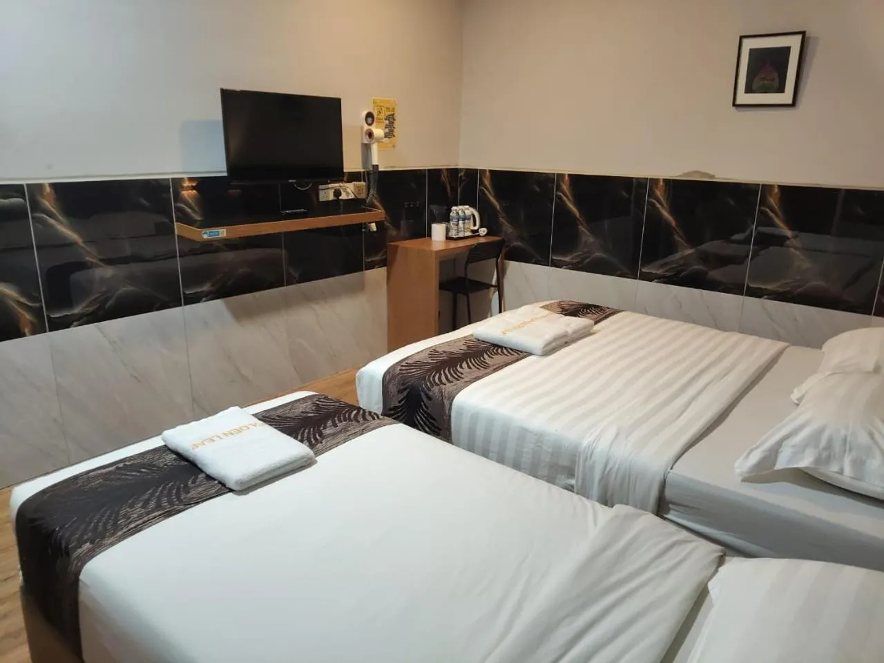 Bed in Golden Leaf Boutique Hotel Nusa Idaman Formerly Known as Ariana Hotel