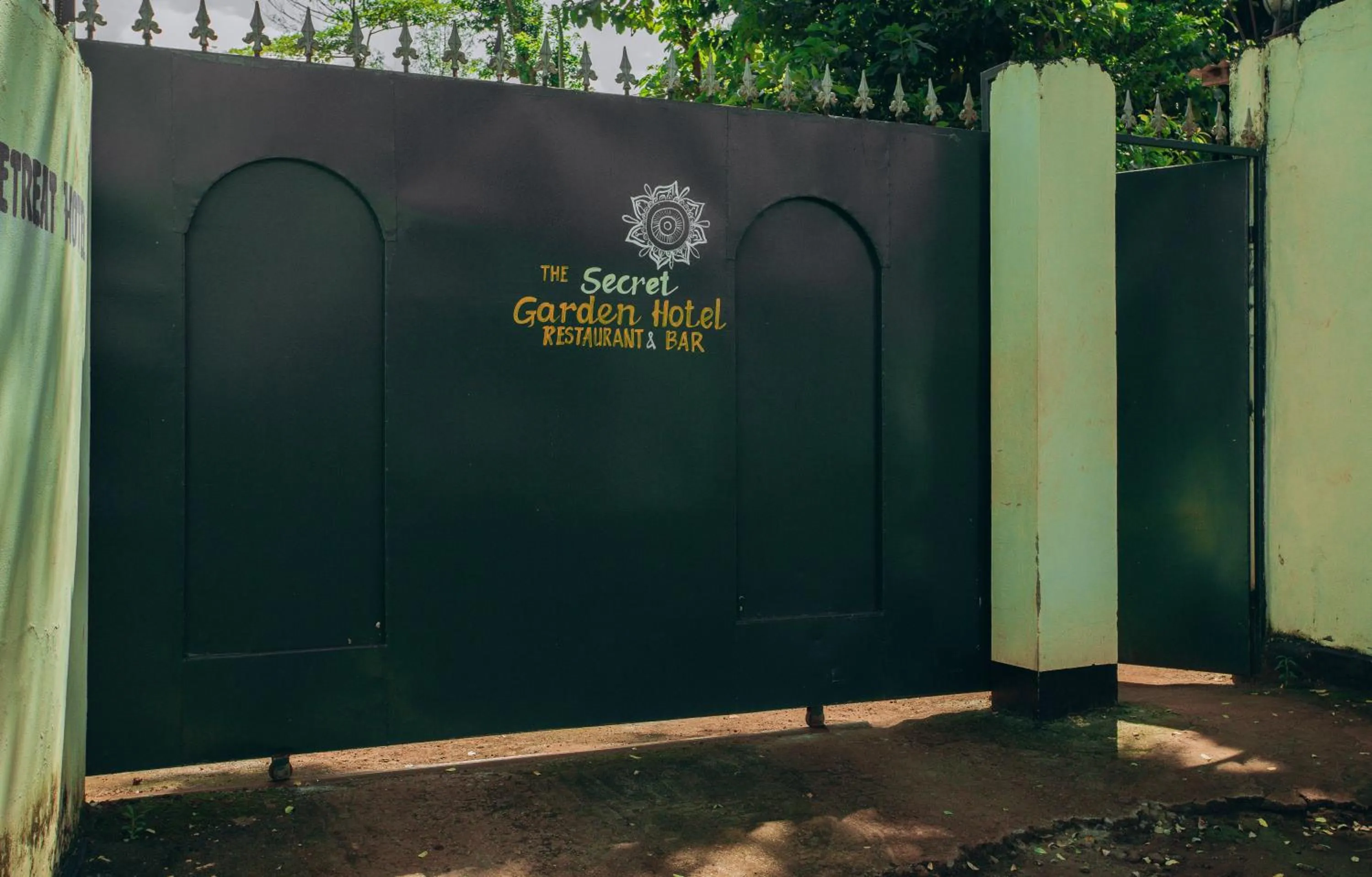 Text overlay in The Secret Garden Hotel Moshi