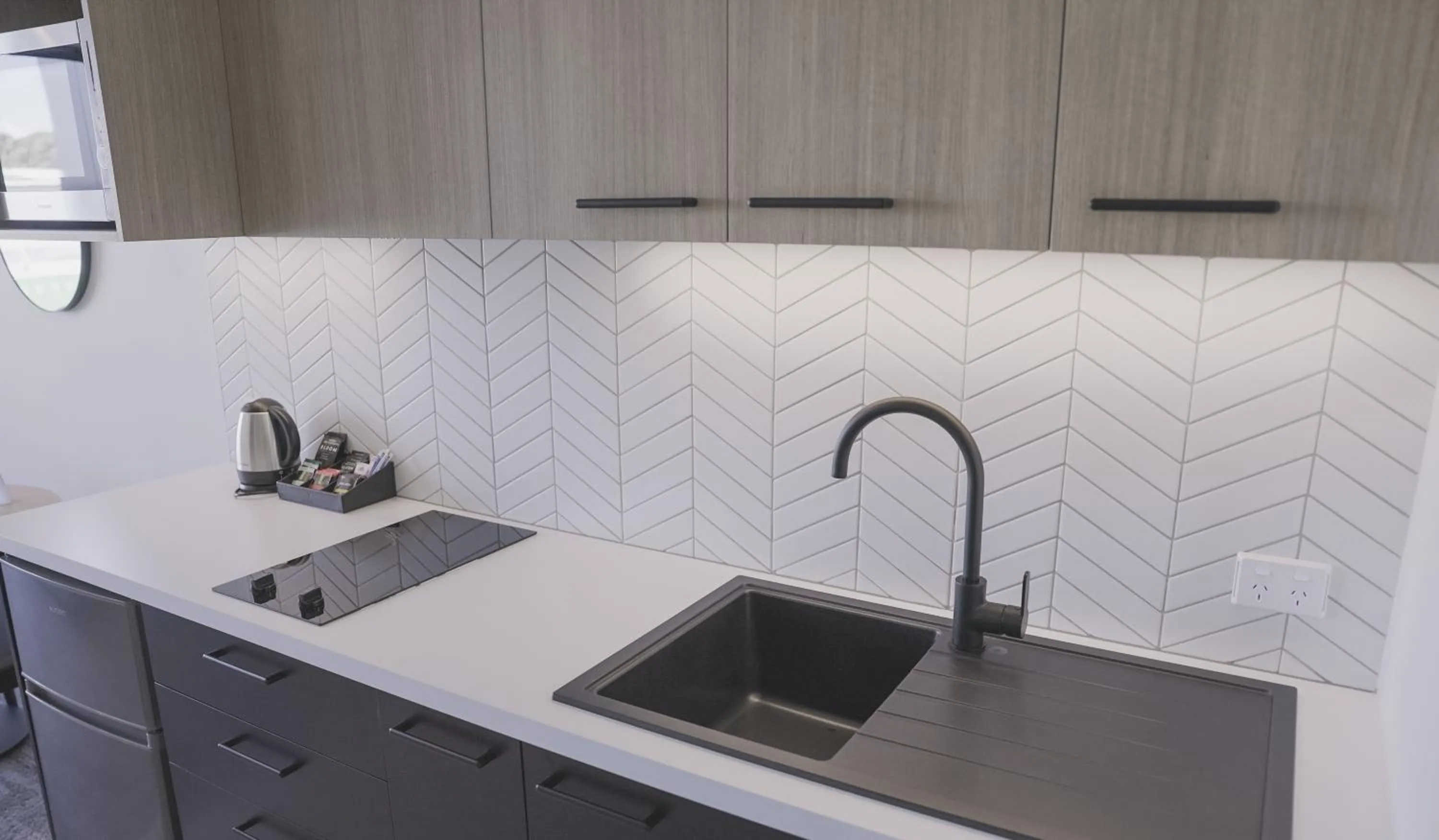 Kitchen or kitchenette in Quest Mt Maunganui