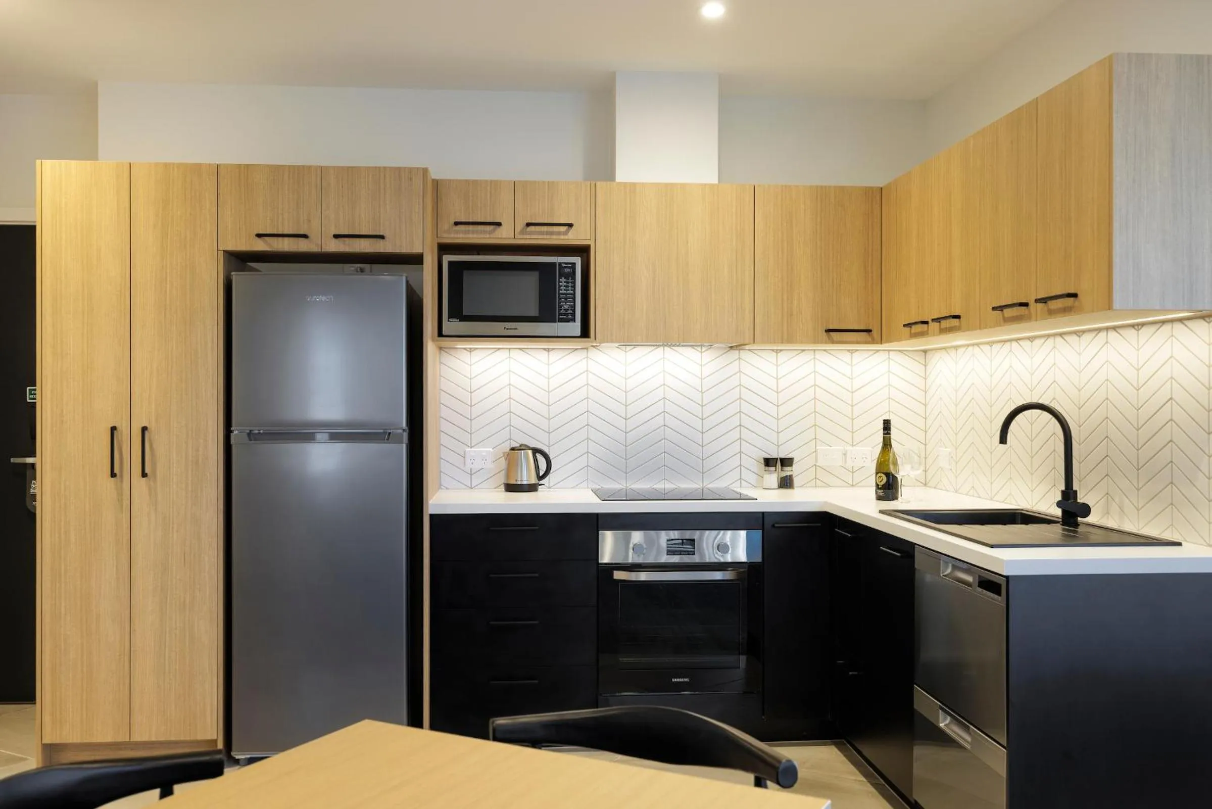Kitchen or kitchenette in Quest Mt Maunganui