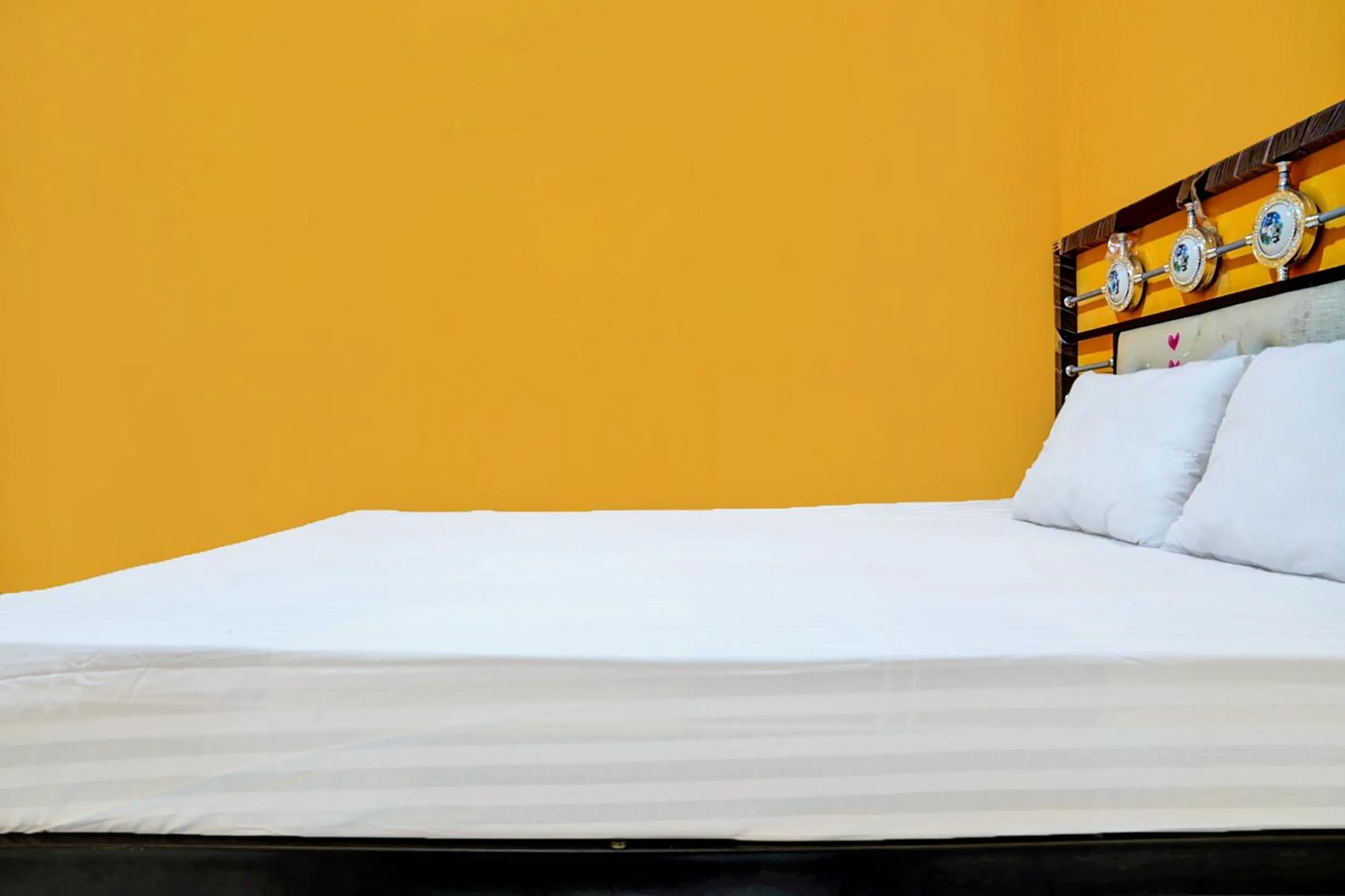 Bedroom in Hotel O Penginapan Hj Lilis Syariah