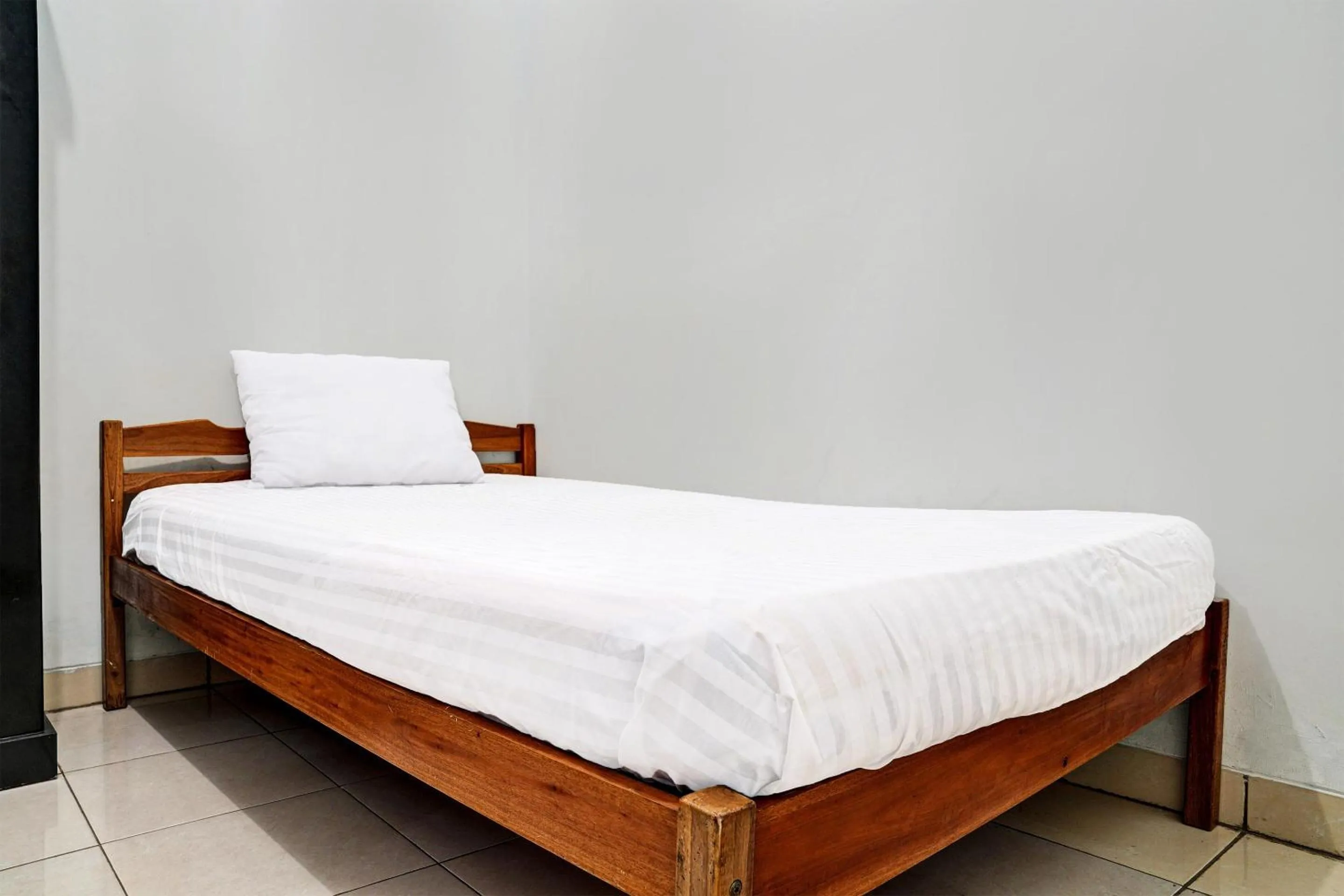 Bedroom in Hotel O Penginapan Hj Lilis Syariah