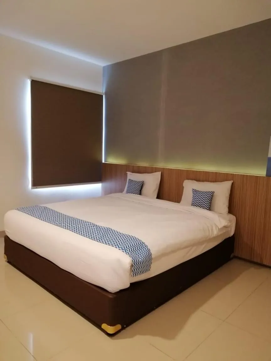 Bed in The Holiday Guest House