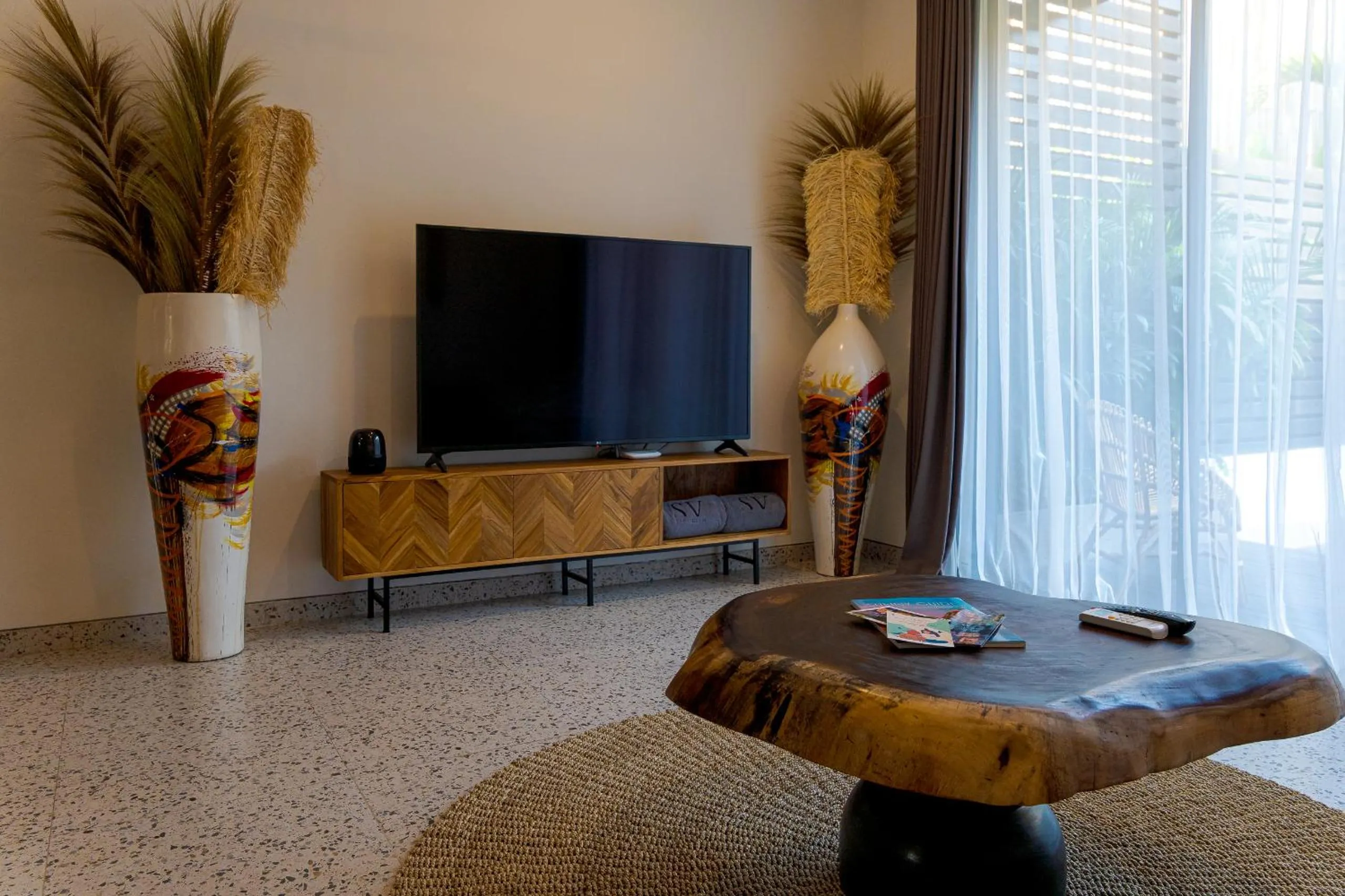 Communal lounge/ TV room in Sunny Village Batu Bolong